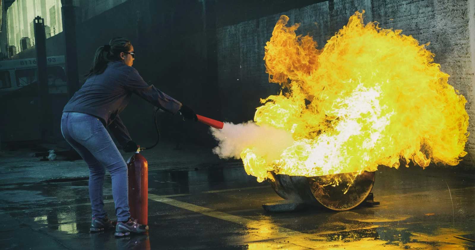 Controlled fire extinguisher training session